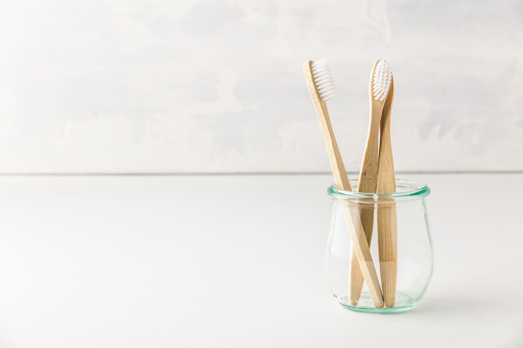 Wooden bamboo tooth brushes in a glas jar